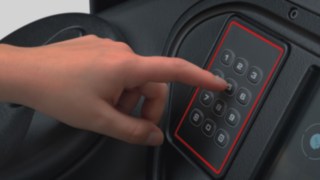 The truck is unlocked by entering a PIN code on the pad, preventing unauthorized use. Detailed image of a PIN pad which the driver users to unlock the truck.