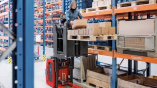 Order picker from Linde Material Handling working in the warehouse 