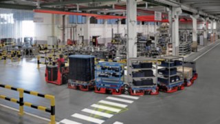 Assembly line supply by the LT10 WX tugger train from Linde Material Handling