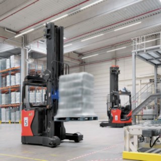Several R-MATICs from Linde MH transport goods through the warehouse.