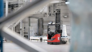 Automated R-MATIC reach trucks from Linde Automated R-MATIC reach trucks from Linde moving around the warehouse.