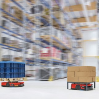 Two C-MATICs from Linde MH are driving through the warehouse