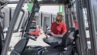 Service technician checks Linde electric forklift