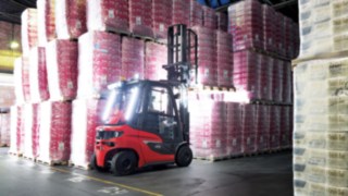 Linde forklift truck stacking fully loaded pallets