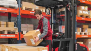 A picking worker sets down a shipment.