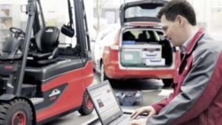 A service technician services a Linde forklift truck