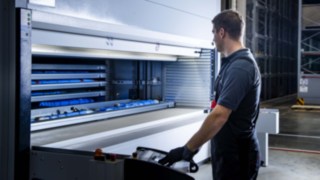 A service technician from Linde MH operates the automated small parts warehouse