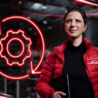 An employee of Linde Material Handling in a warehouse with a glowing red gear symbol in the background.