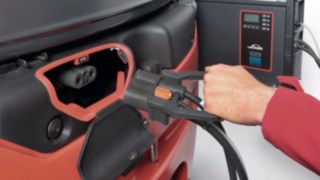 Linde e truck with Li-ION battery connected to the charger