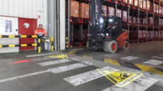 The Linde Safety Guard warns pedestrians of an approaching forklift truck by projecting a symbol onto the floor.