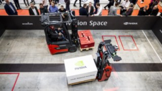 Two Linde Material Handling trucks transporting loads at LogiMAT 2025.