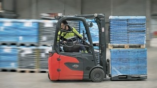 DB Schenker employee loads truck with Linde E16 electric forklift truck