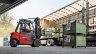 Eibach Oberflächentechnik GmbH (EOT) tests the X35 electric forklift truck from Linde. X35 electric forklift from Linde unloads a truck.