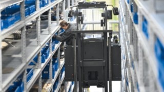 Linde order picker between high racks