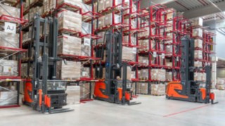 Three Linde MH narrow-aisle order pickers in the warehouse at K2 Systems
