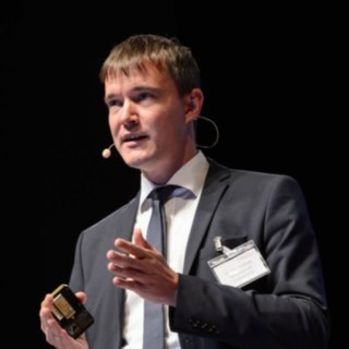 Andreas Lewandowski at the MH Symposium 2017 Andreas Lewandowski during a presentation.