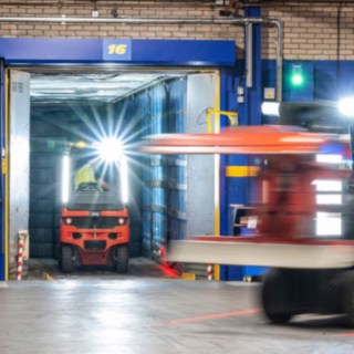 Two counterbalance forklifts Linde E20 at work in Michelin Tyre PLC´s warehouse.