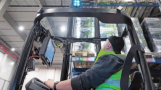 Reach truck in use on high shelving