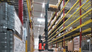 The Linde R-MATIC stores a pallet in high shelving.