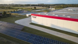 The plant in Kołbaskowo, Poland, which manufactures products for Linde MH, featuring a large outdoor photovoltaic system.