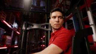 Close-up of driver inside the ergonomic Linde MH reach truck Ri16.