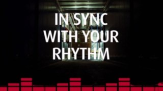 View from a lorry loading area into a warehouse with pallets and racks