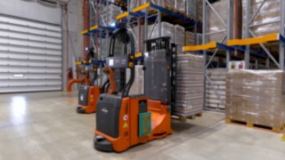 The automated L-MATIC AC counterbalanced pallet stacker in use.