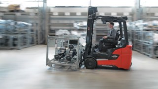A group of people analyzing the working environment in a logistics hall.