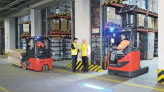 Inspection of the Blue spot by two people in a warehouse