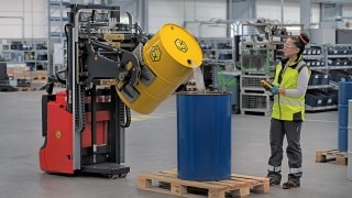 An employee operates a remote-controlled, explosion-proof high-lift truck from Linde Material Handling